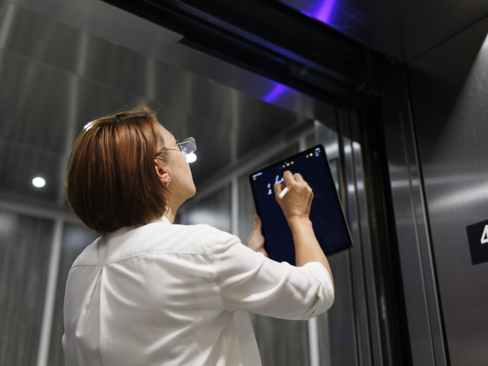 Elevator Technician conducting assessment.